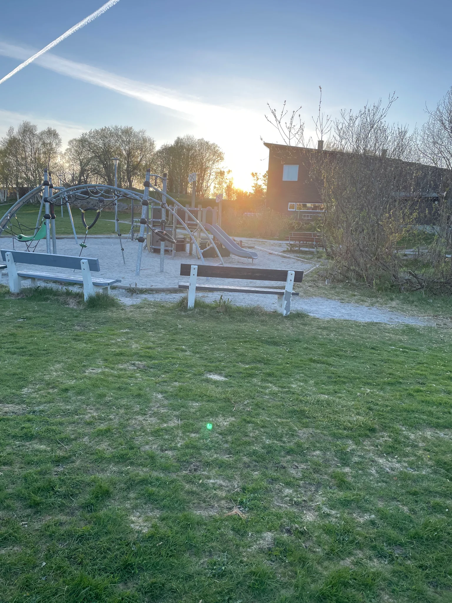 Bench: a bench by a playground